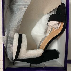 Women’s black, open toed high heels